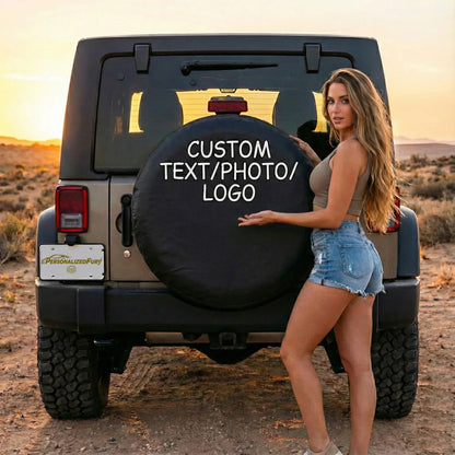 Custom Jeep Spare Tire Covers featuring a model showcasing a black tire cover with customizable text.