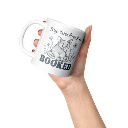 Funny_Corgi_And_Book_Coffee_Mug_Lifestyle_Raised_Hand_LH_Mockup.png
